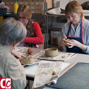 My students working on a clay object